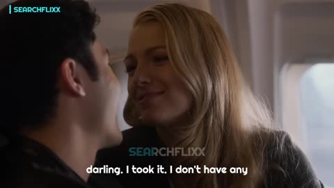 Emily asks her husband to join her in the airplane bathroom.