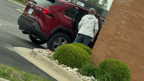 Lady Takes Rocks From Parking Lot