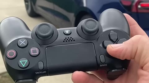DRIVING A TESLA WITH A PS4 CONTROLLER! - #shorts