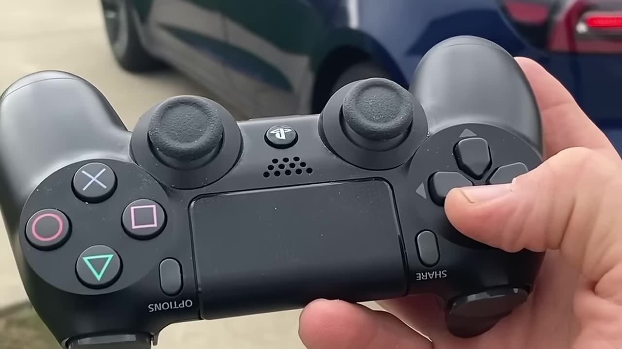 DRIVING A TESLA WITH A PS4 CONTROLLER! - #shorts