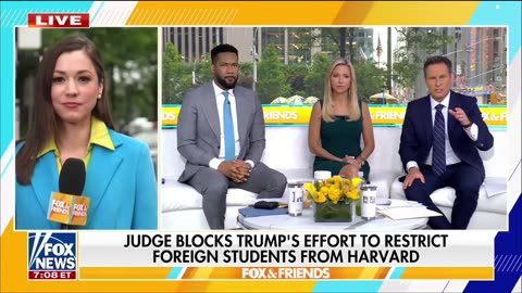 The president of Harvard takes aim at Trump in