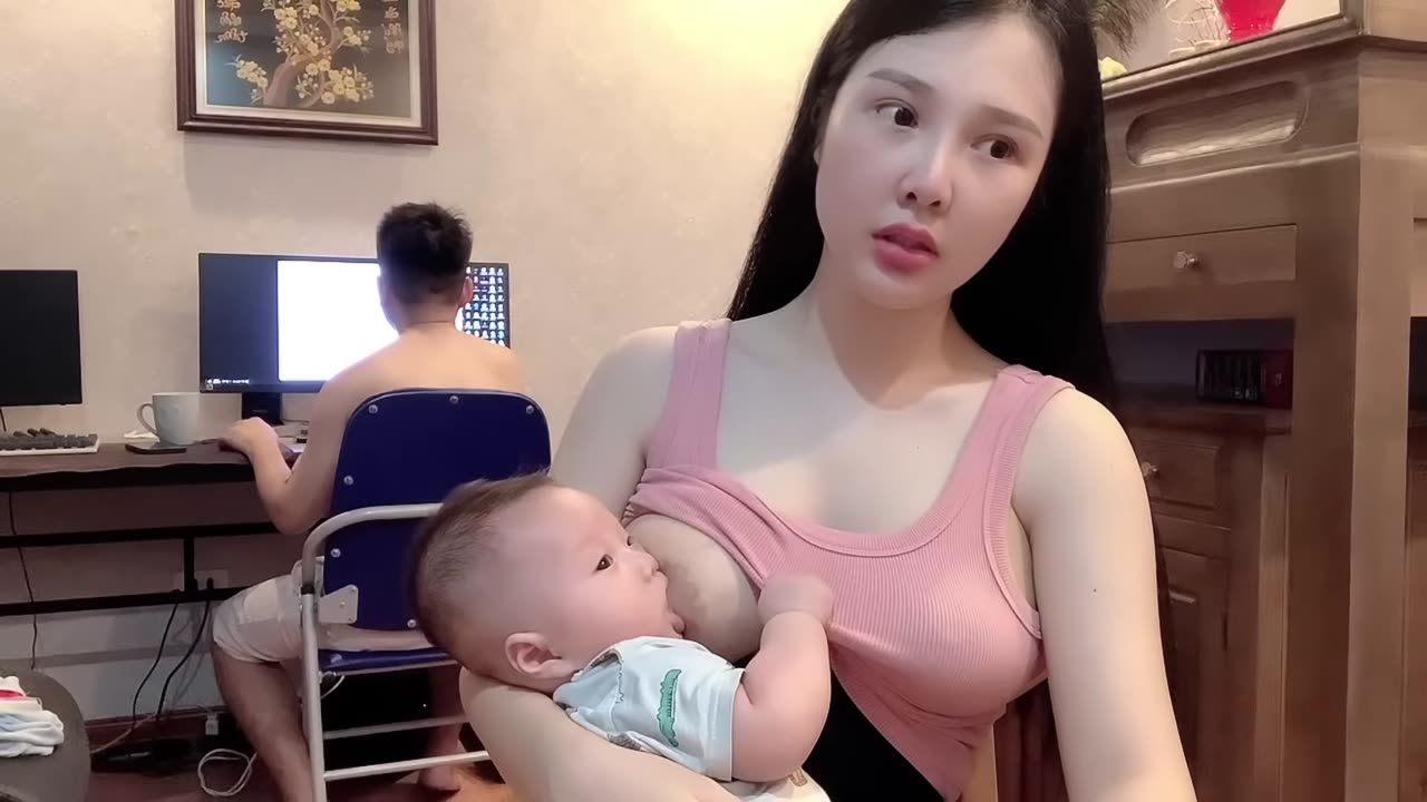 Breastfeeding: Feeding a Baby with Pretty Mother