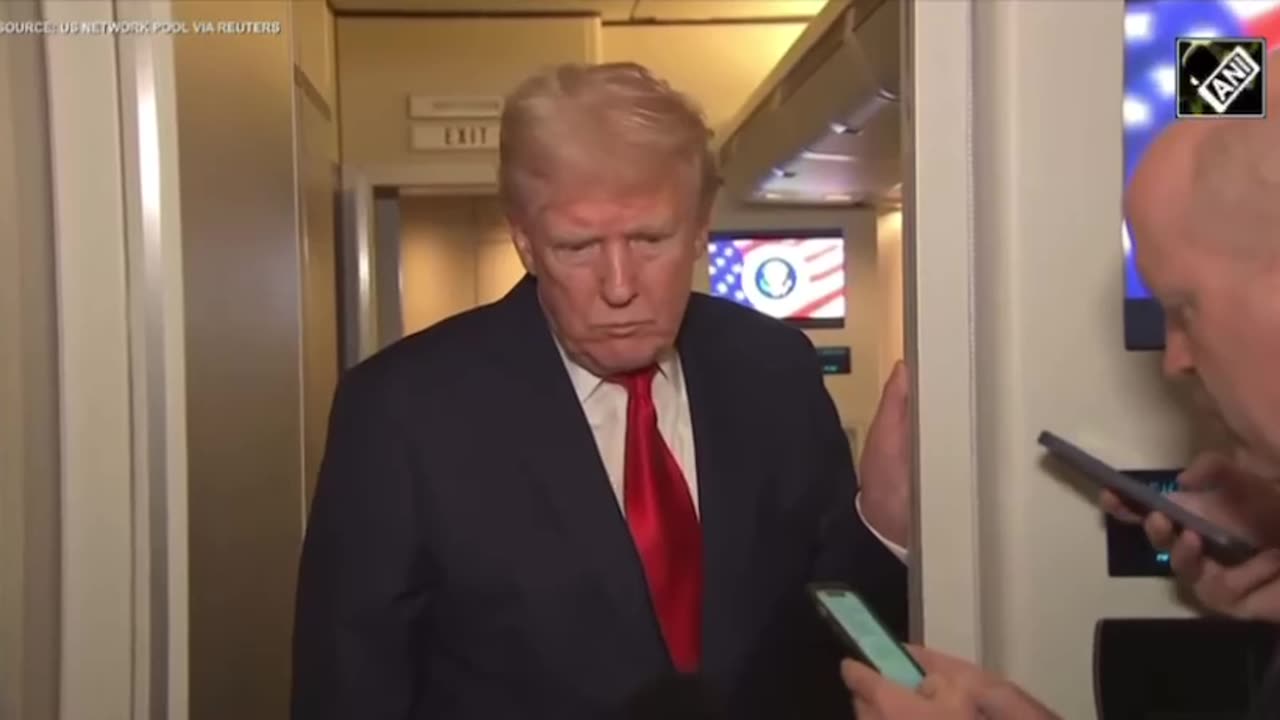 President Trump interacts with press on Air Force one