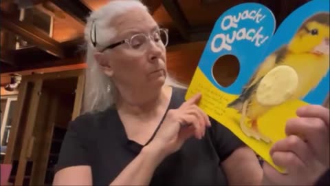 Reading a childs book. Quack Quack