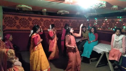 The village girls are dancing beautifully to the beat of Bengali songs.