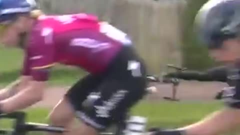 Trending: Spectator Crashes While Riding Alongside Peloton! #shorts