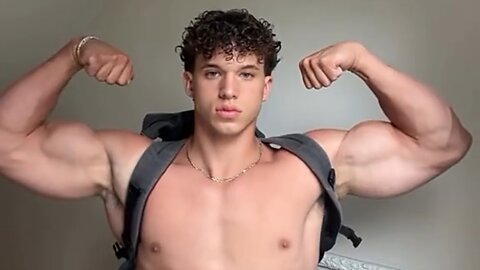 Handsome muscular man showing off his muscles