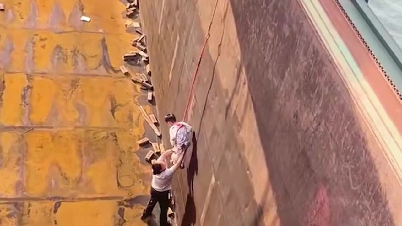 Check out this dad lowering his son on a big ship!.hd