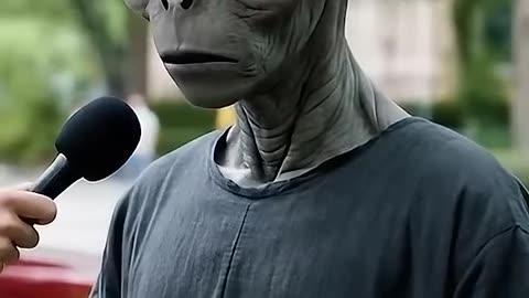 Alien answering an interviewer