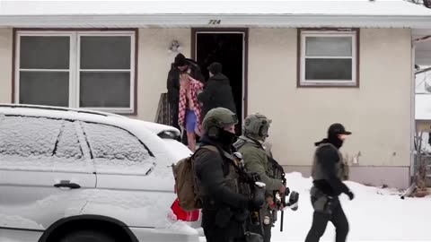 ICE agents raid Minnesota house, detain man as observers heckle