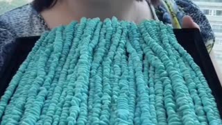 Natural turquoise beads freeze eons of turquoise flow