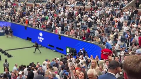 President Donald J. Trump signs supporters' hats at the US Open 
