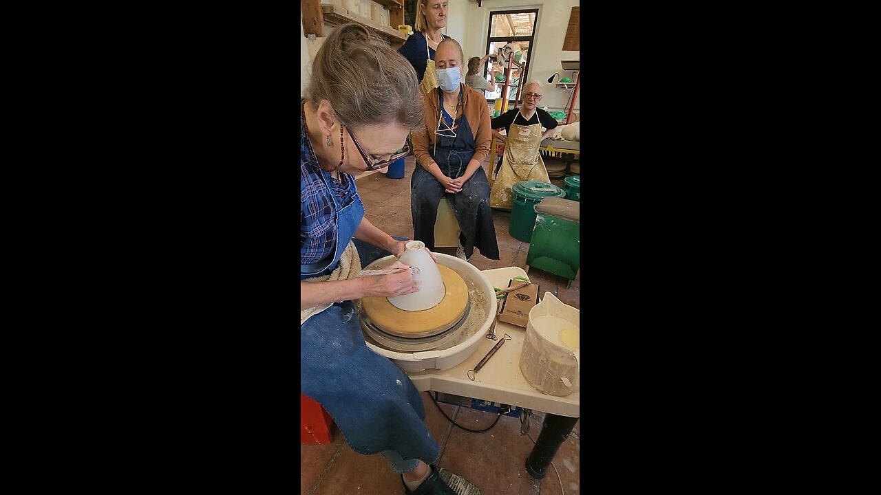 Trimming porcelain on a foam-bat.