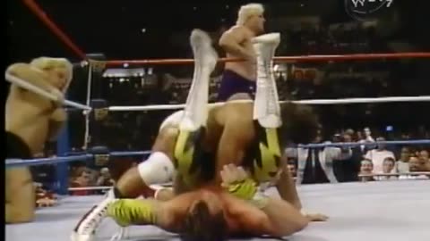 Brutus beefcake in yellow lightning tights/pants gets his hair cut
