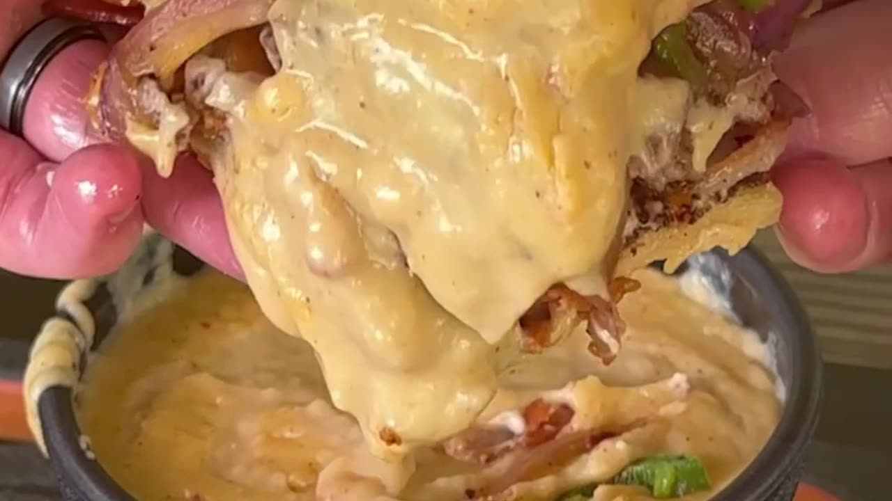 Beef burger with crispy beacon and cheese sauce