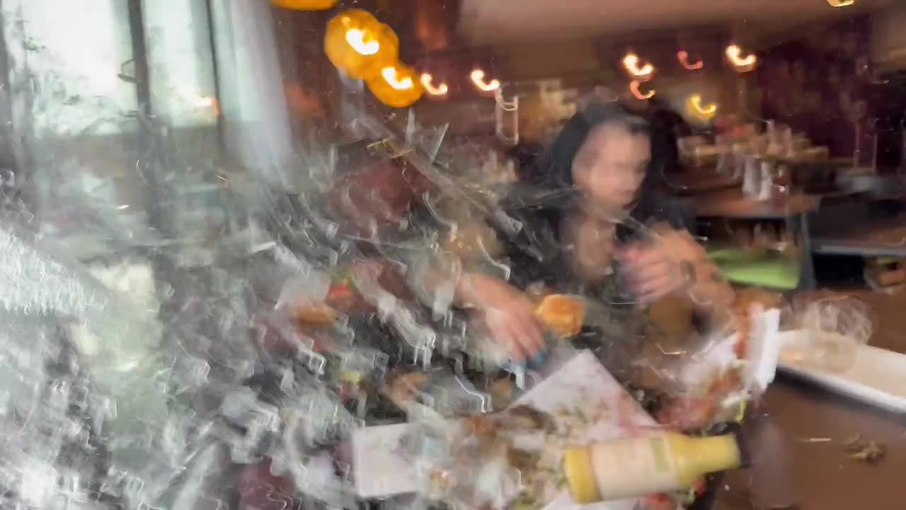 Food influencers were hit by a car while reviewing a burger inside a restaurant.