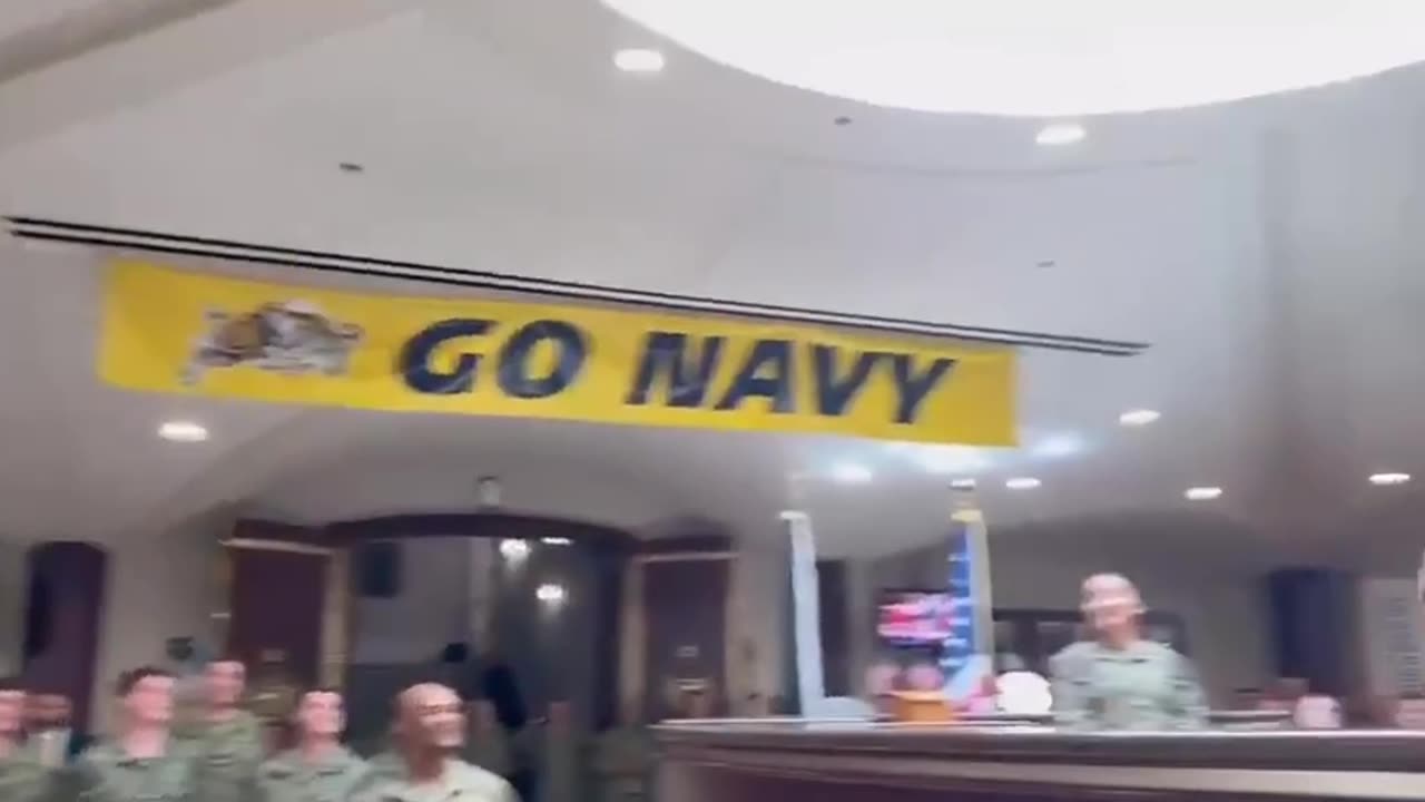 Defense Secretary Pete Hegseth throws a football with the troops