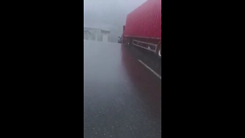 A truck cab, with the driver still inside, was left hanging over the abyss after a bridge collapsed