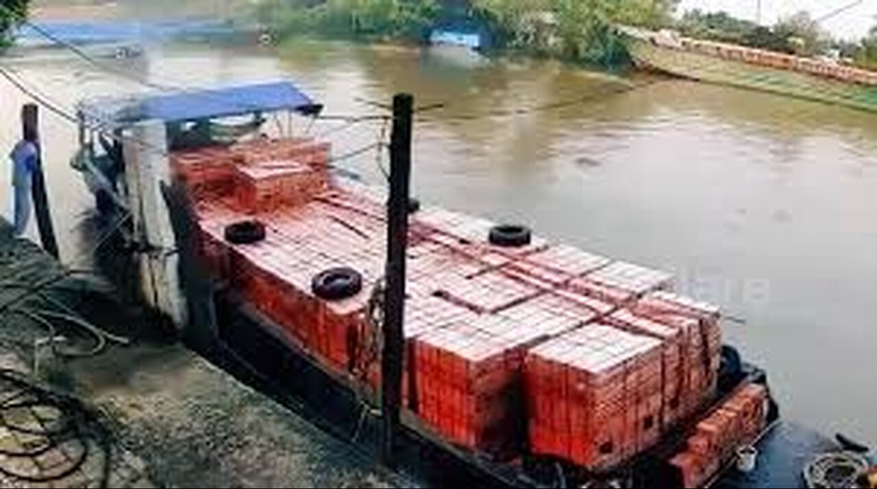 Barge carrying bricks capsizes as fast-footed worker scurries to safety