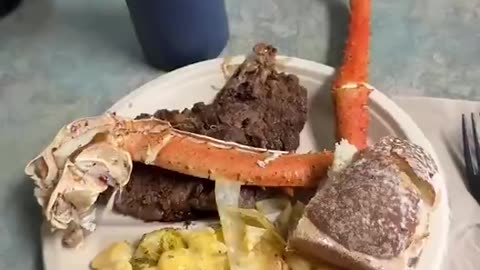 US soldier shows that they are being served "steak and lobster"