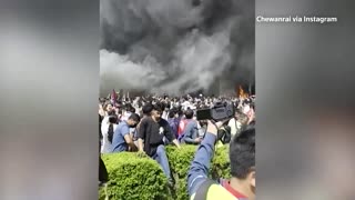 Fire rages at Nepalese parliament after protests spiral