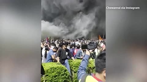 Fire rages at Nepalese parliament after protests spiral
