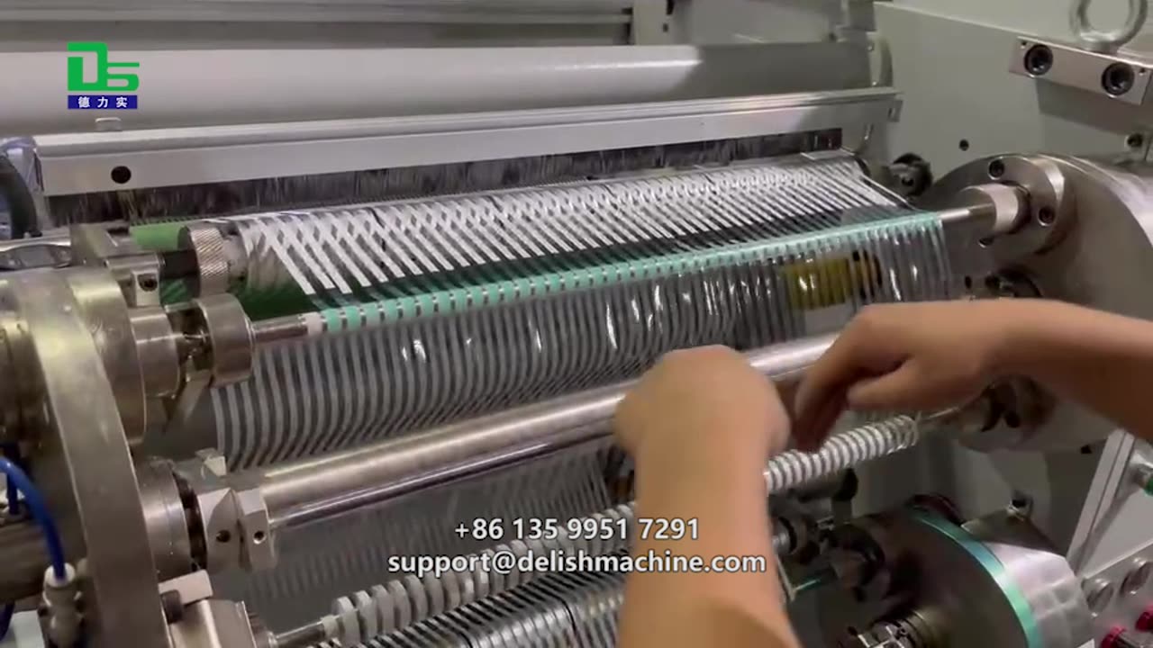 Correction tape slitter, slitting and rewinding into separate small rolls