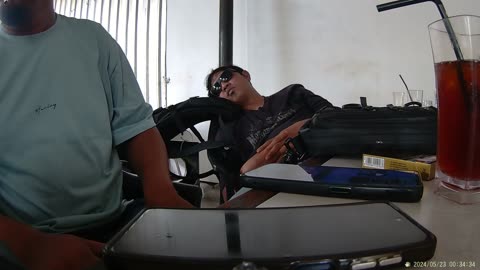 "Overworked and Out Cold: Man Falls Asleep at His Desk"