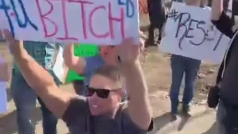 Fearless Alex Jones Confronts Tesla Protesters to Their Faces From the Back of a Cybertruck