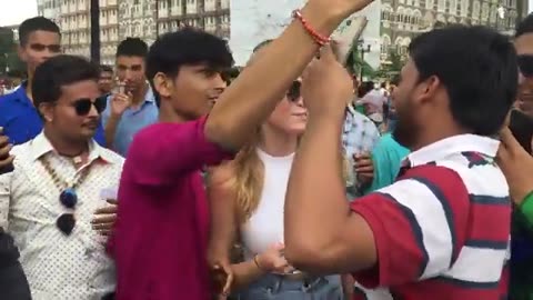 INDIAN PERVERTS: A Horde of Jeets Surround a White Woman Visiting India, Pestering Her for Photos