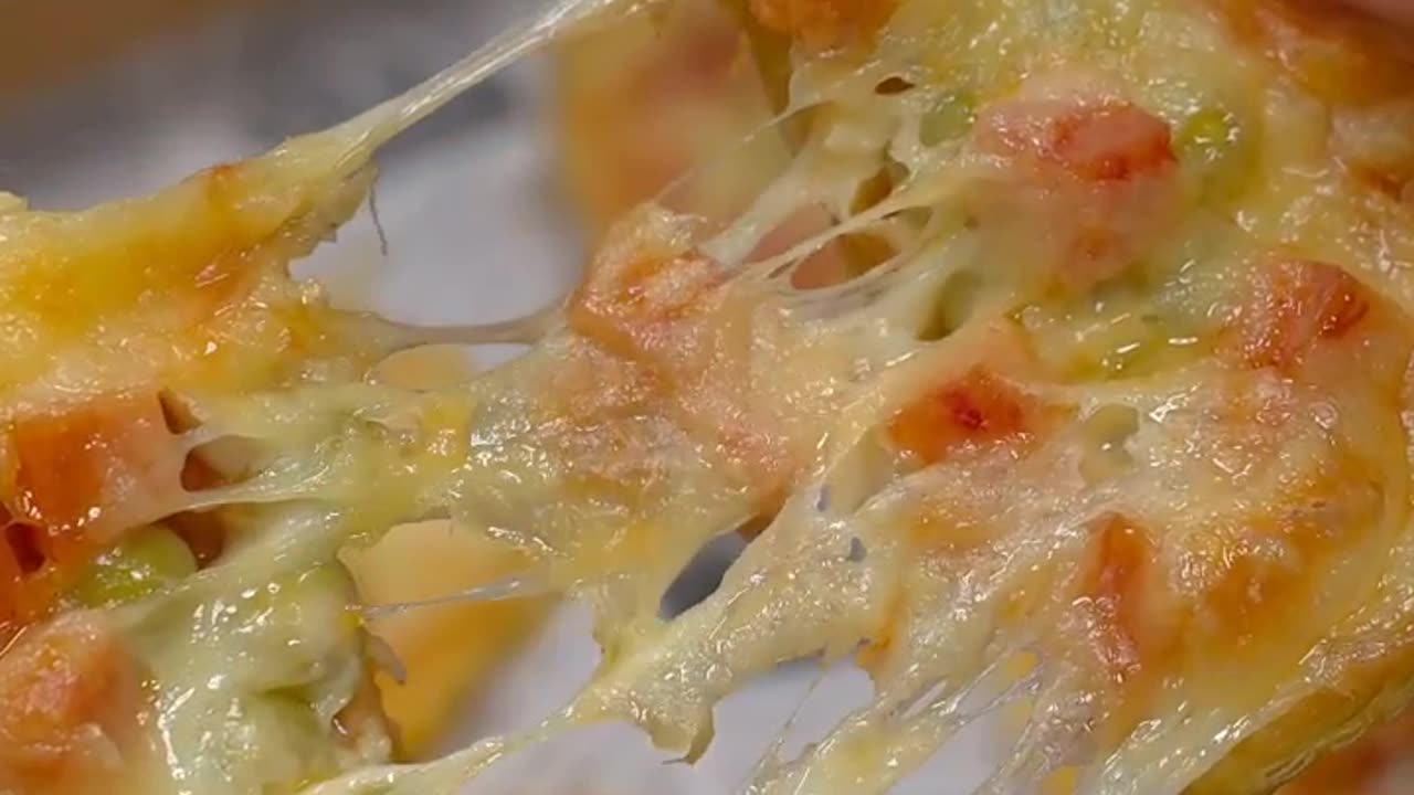 Baking Pastry with sausages, cheese, peas as topping