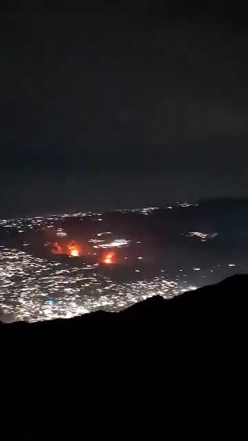 Footage from a vantage point, showing multiple explosions across the Venezuelan capital of Caracas.
