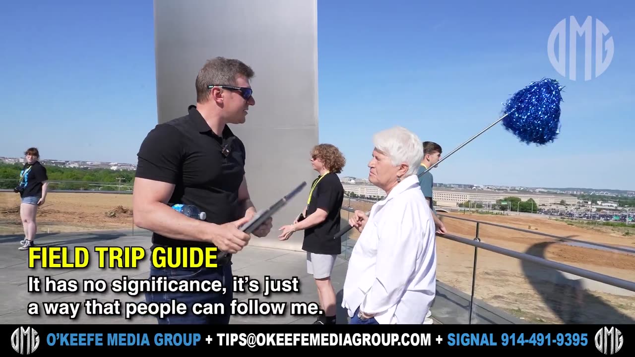 O'Keefe Faces Off in Front of Pentagon with D.C. Chaperone Wielding a Pom-Pom Baton