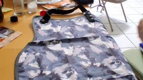 Adult Waterproof Bib. We try it out & give you our opinion. With waterproof pocket to catch crumbs.