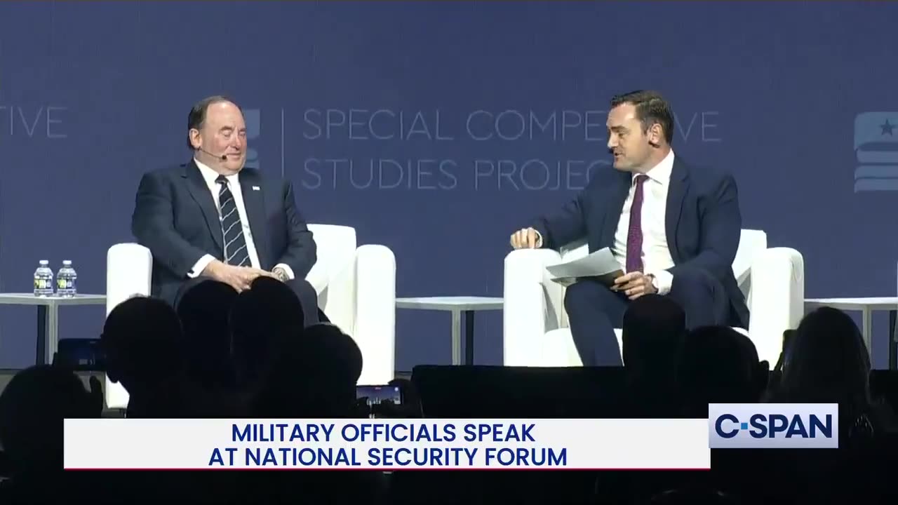 How did they get so close to the Sec of the Navy at a NATIONAL SECURITY FORUM?