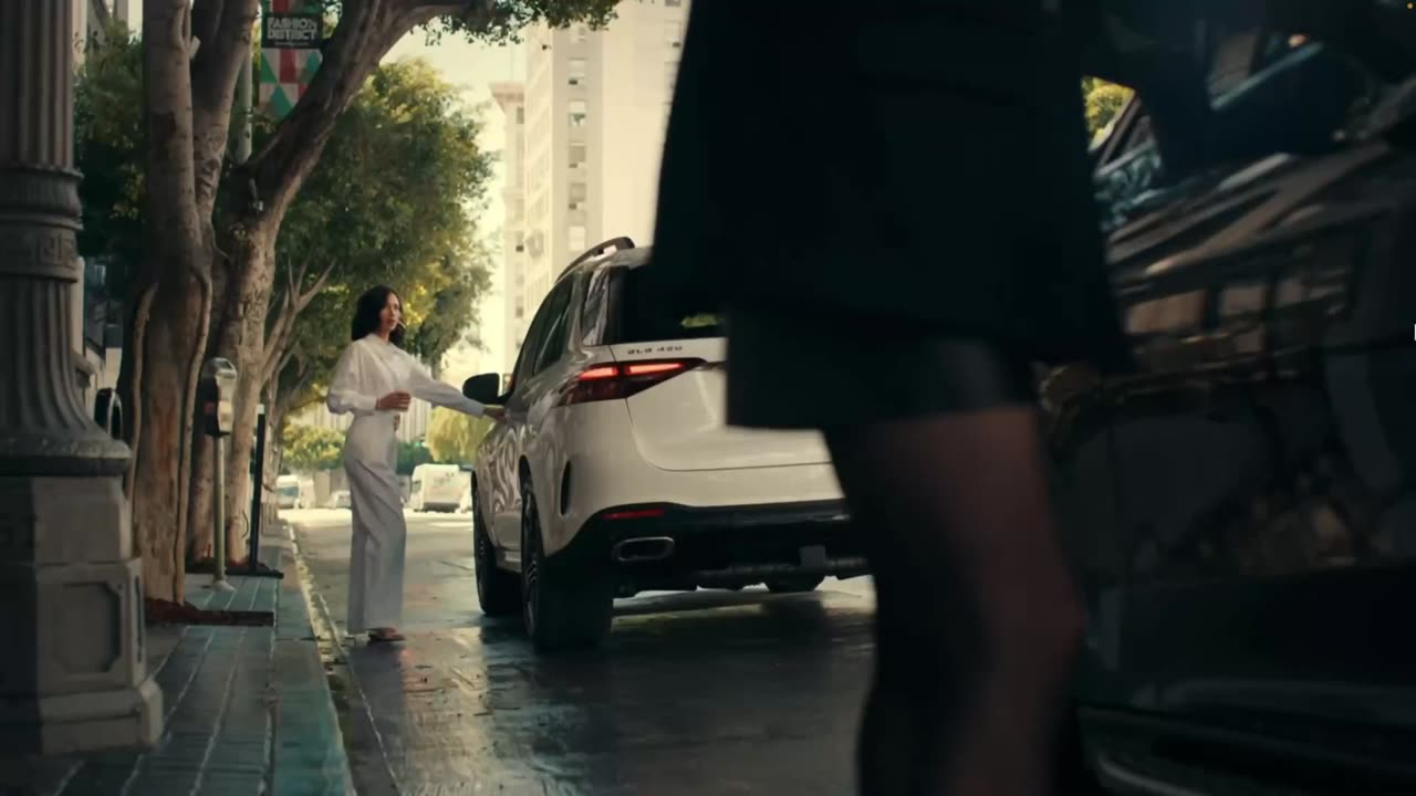 The Only Way To Make An EV Interesting Is Using A Broad In Sexy Gloves To Sell It