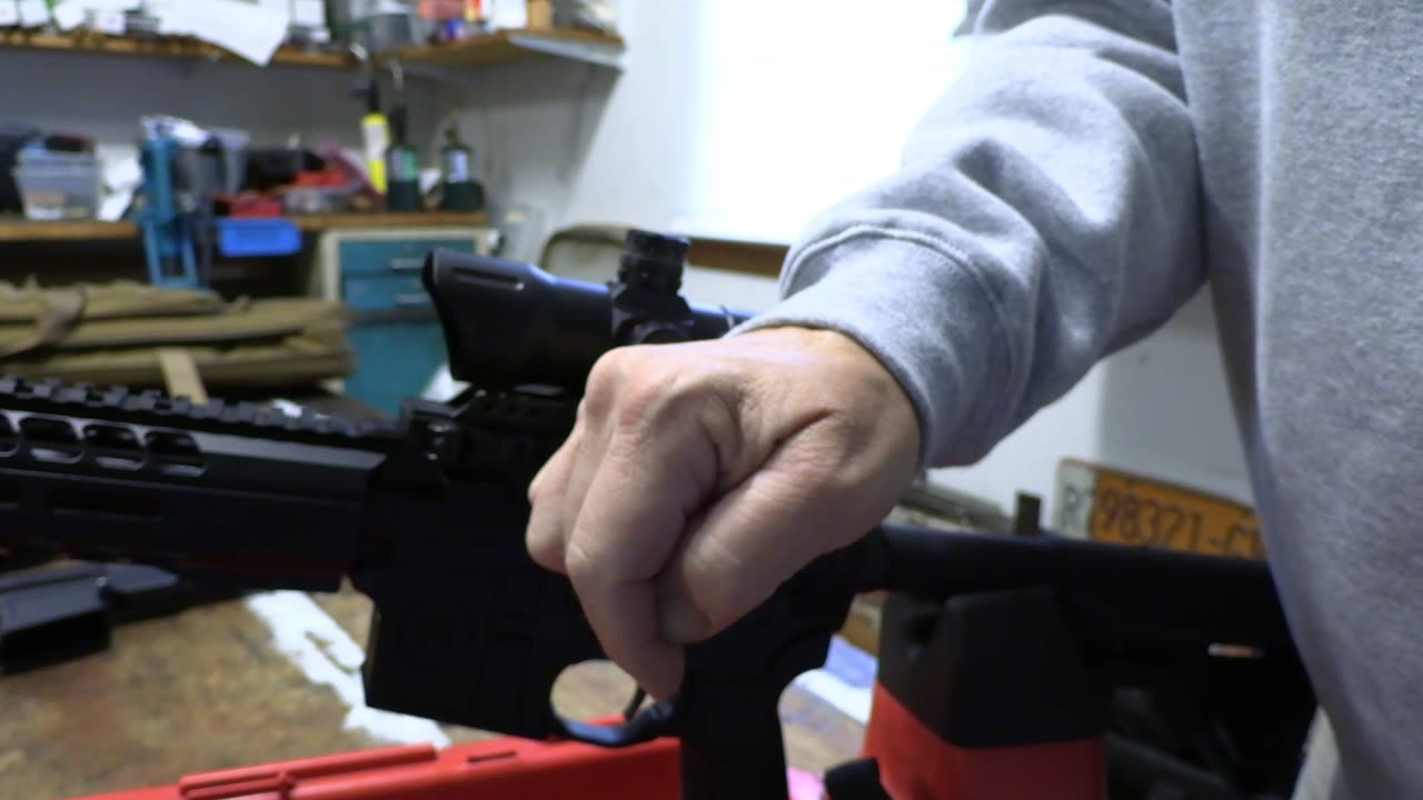 Mounting UTG T dot optic to AR 15 rifle.