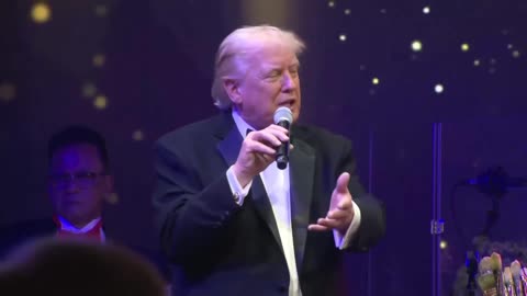 AUCTIONEER President Trump at Mar-a-Lago for the painting of Jesus Christ, for charity