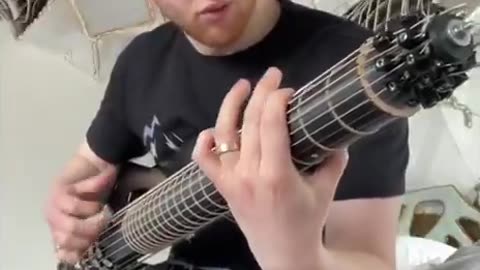 A Musician has made a Rotating Guitar