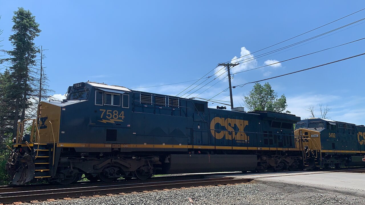 CSX Trains 7584 and 5492 head East