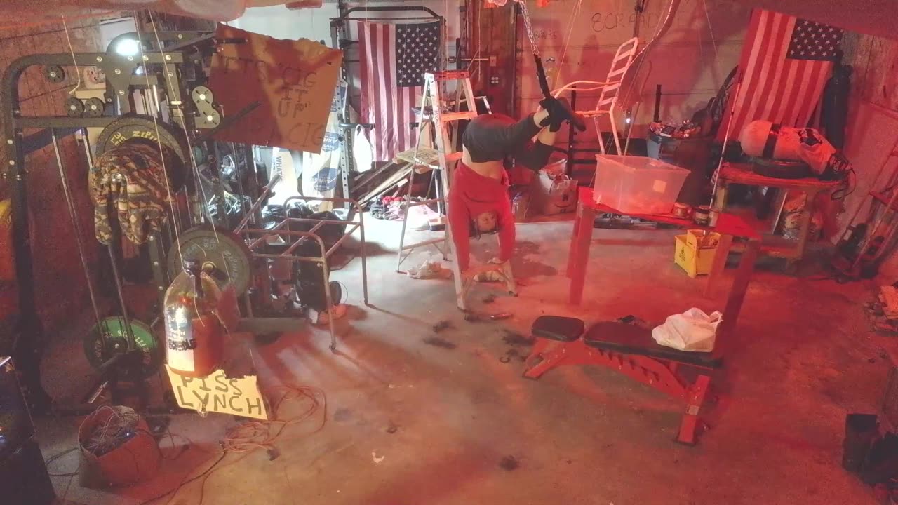 Insane person cutting his hair while hanging from the ceiling (VanceVictim2018)