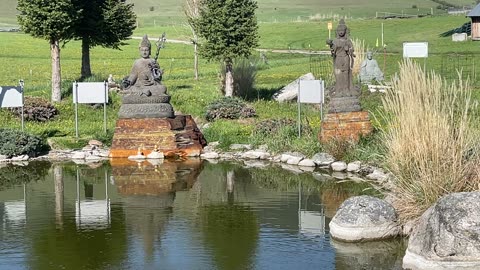 Garden of 1000 Buddhas, Statue of renown people in history/mythology around a coy pond on a SunnyDay