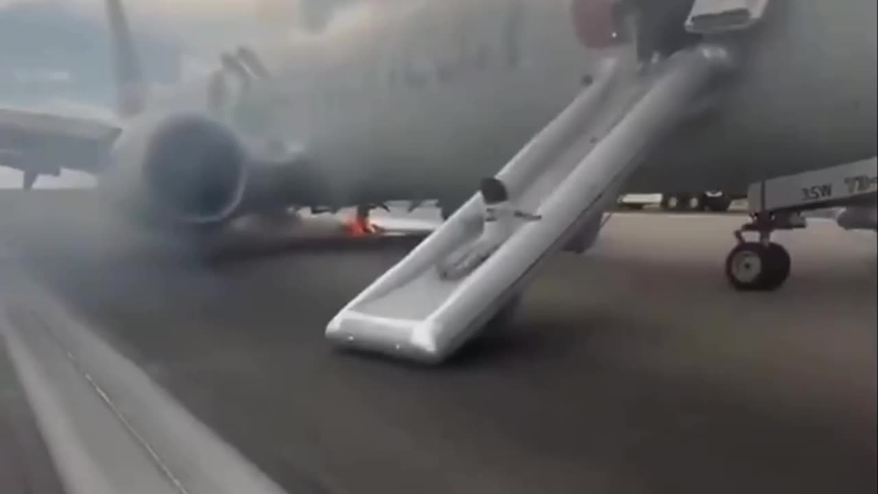 PANIC on runway as wheel of American Airlines plane catches FIRE