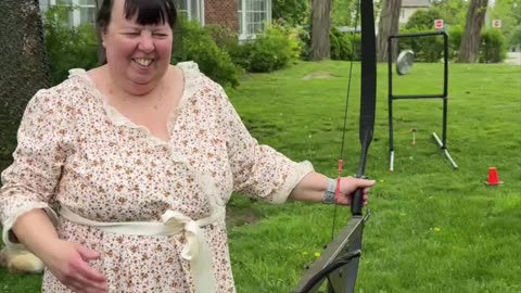 In the spirit of the old world, she stands in her prairie dress