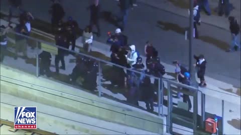 It's about time - Police tackle an agitator to the ground in Los Angeles