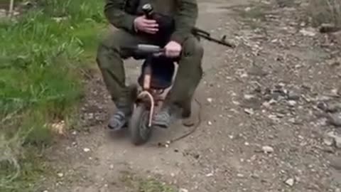 🚲😲 Ukraine Russia War | Russian Soldier Rides Stolen Child’s Bicycle in Combat Zone | RCF
