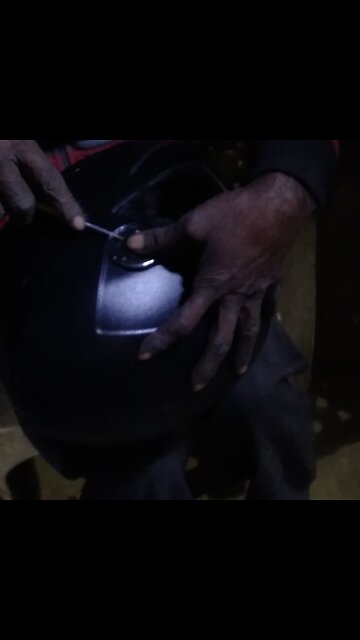 expertise in action as they restore safety and style. #HelmetFix #MechanicSkills