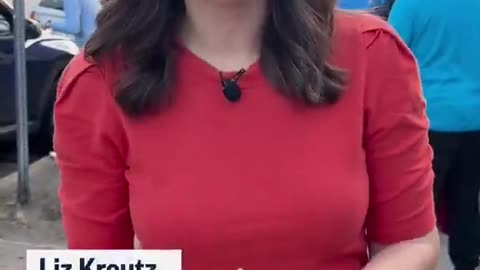 Video of people pulling up to a food bank in LA