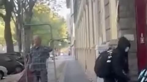 Migrant armed with a vacuum cleaner smashes the window of a motorcycle shop