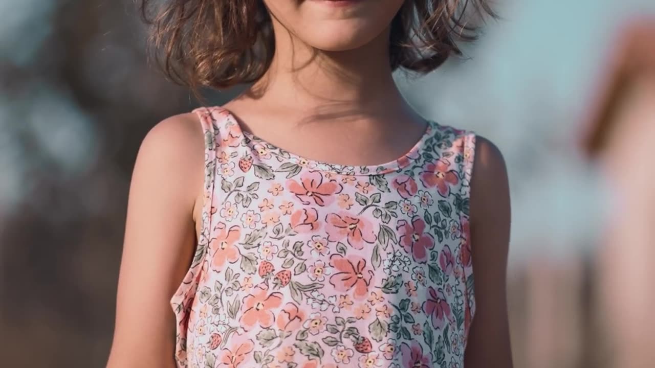 Joyful Child Running in Sunlit Field
